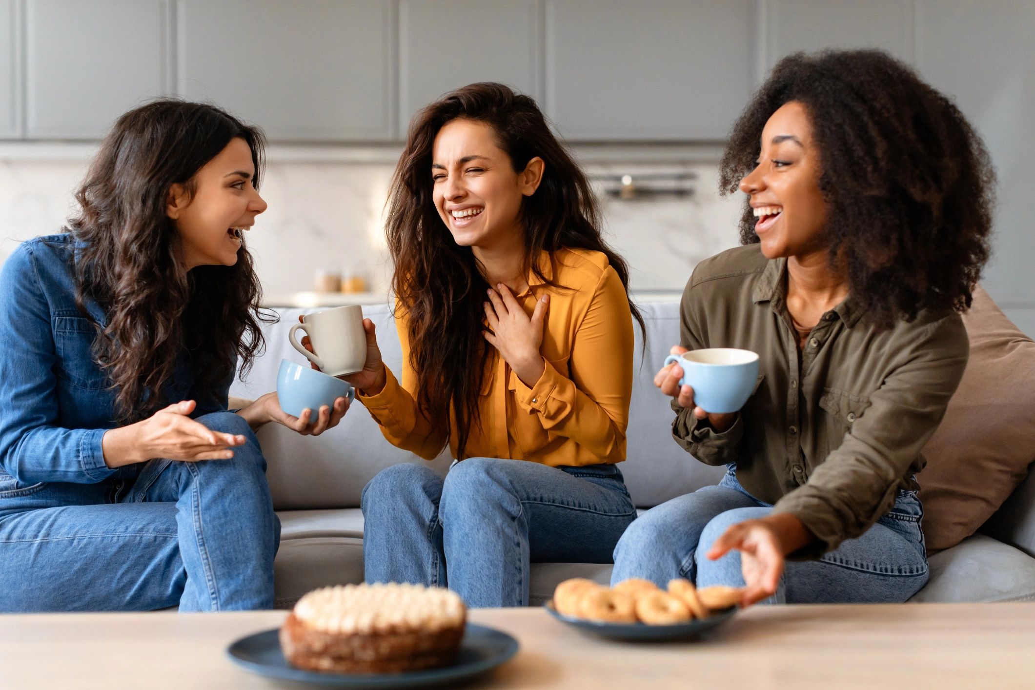 Friends sharing conversation and pastries