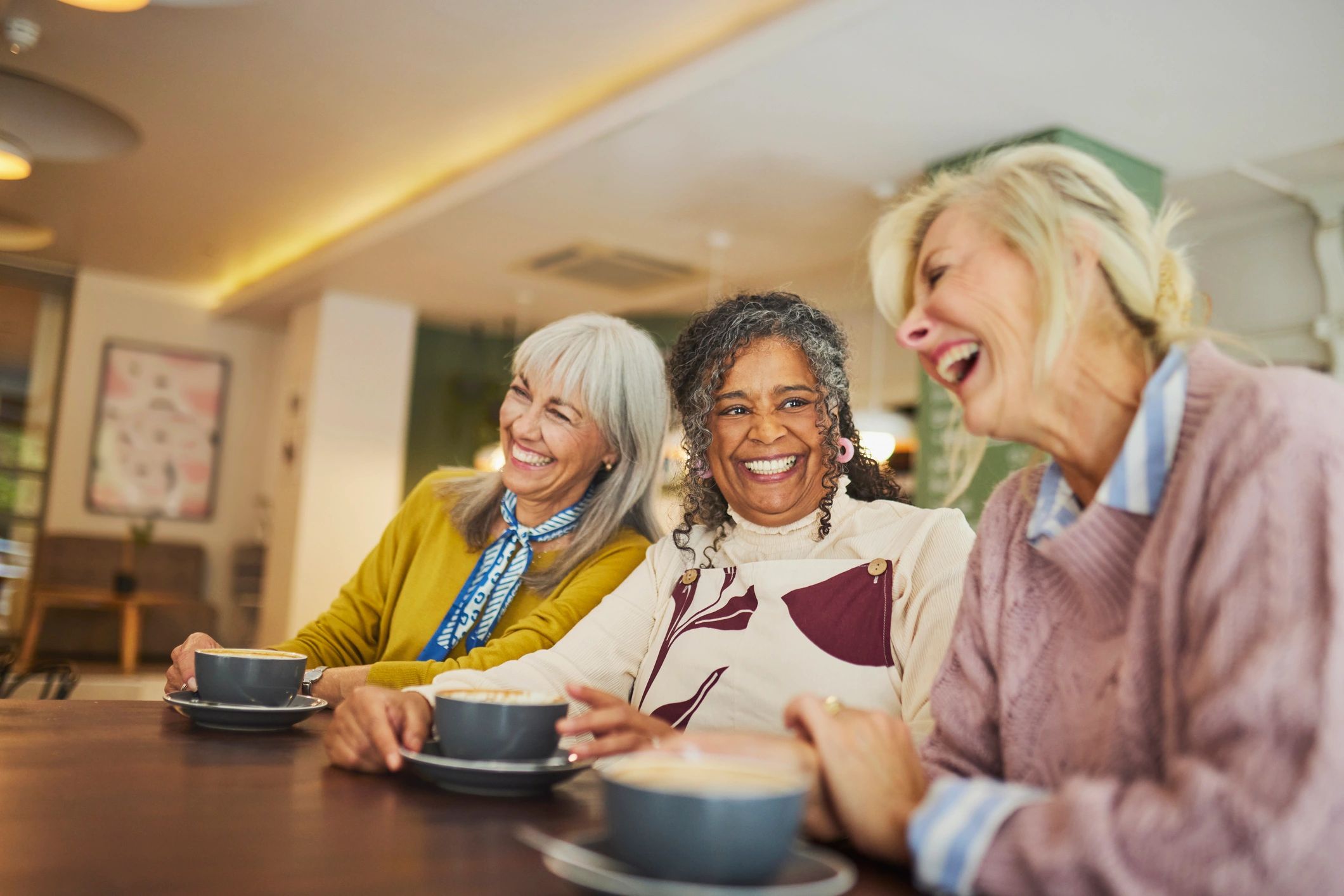 Community member enjoying coffee with friends